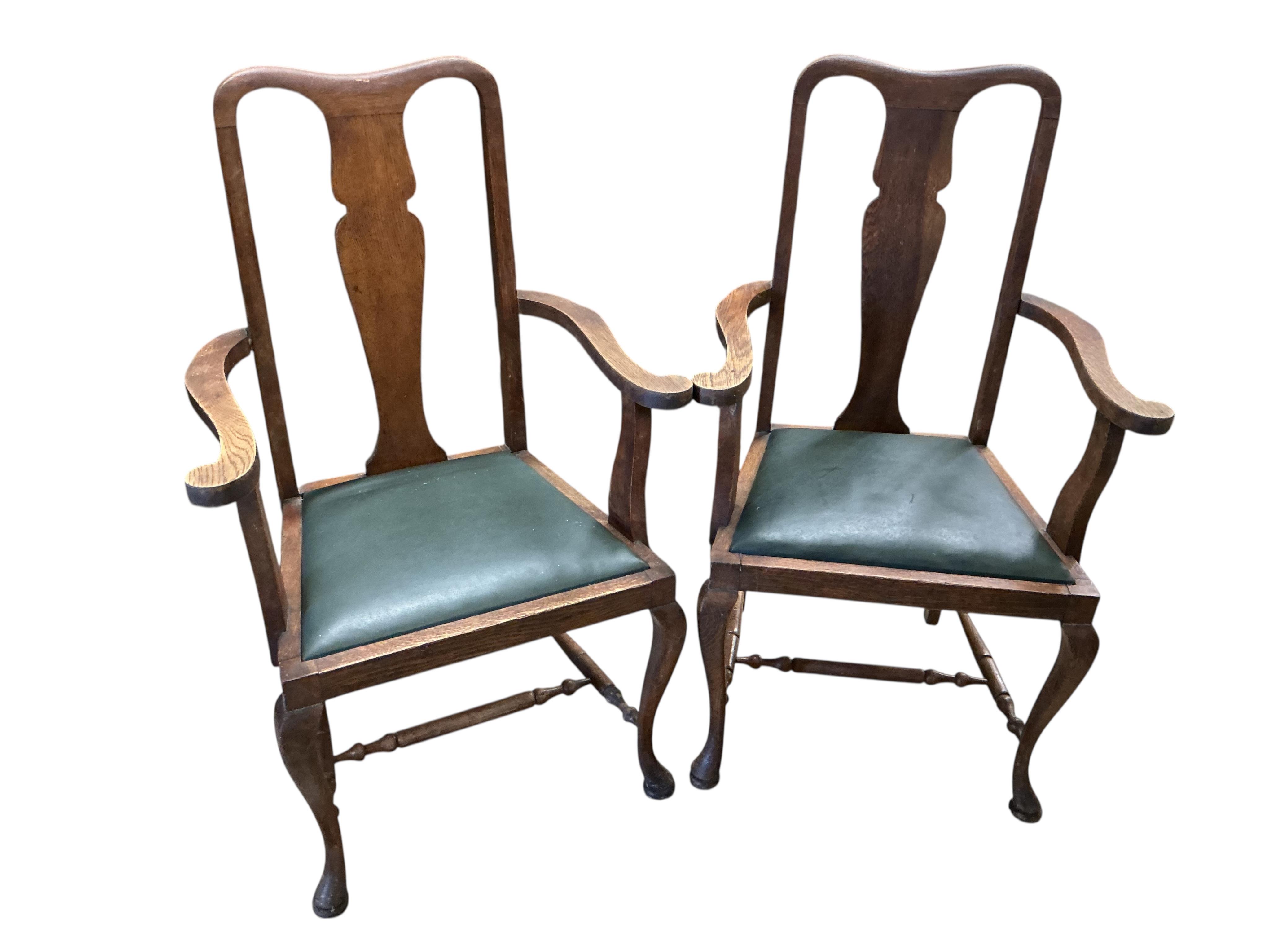 A set of eight early 20th century oak dining chairs, two with arms